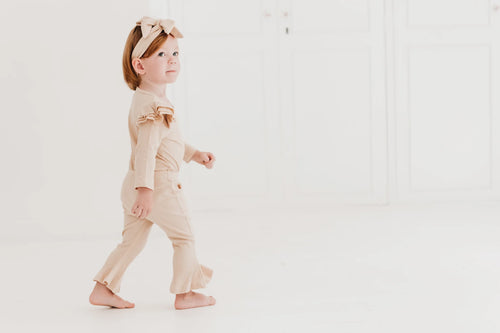 Frilly layered onesie, bell bottom pants & bow headband