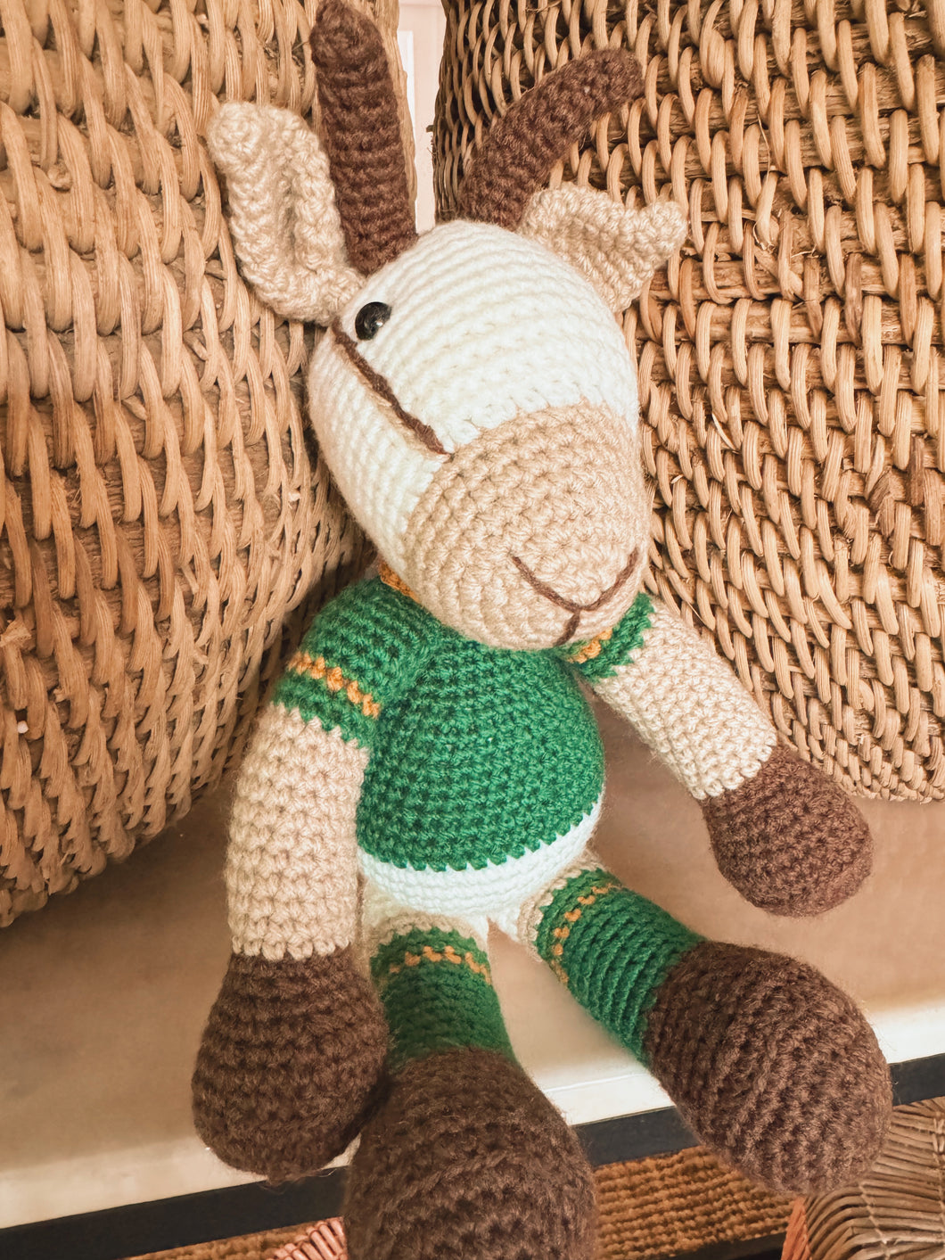 Green and gold crochet toy giraffe with rugby-style scarf, handmade baby gift